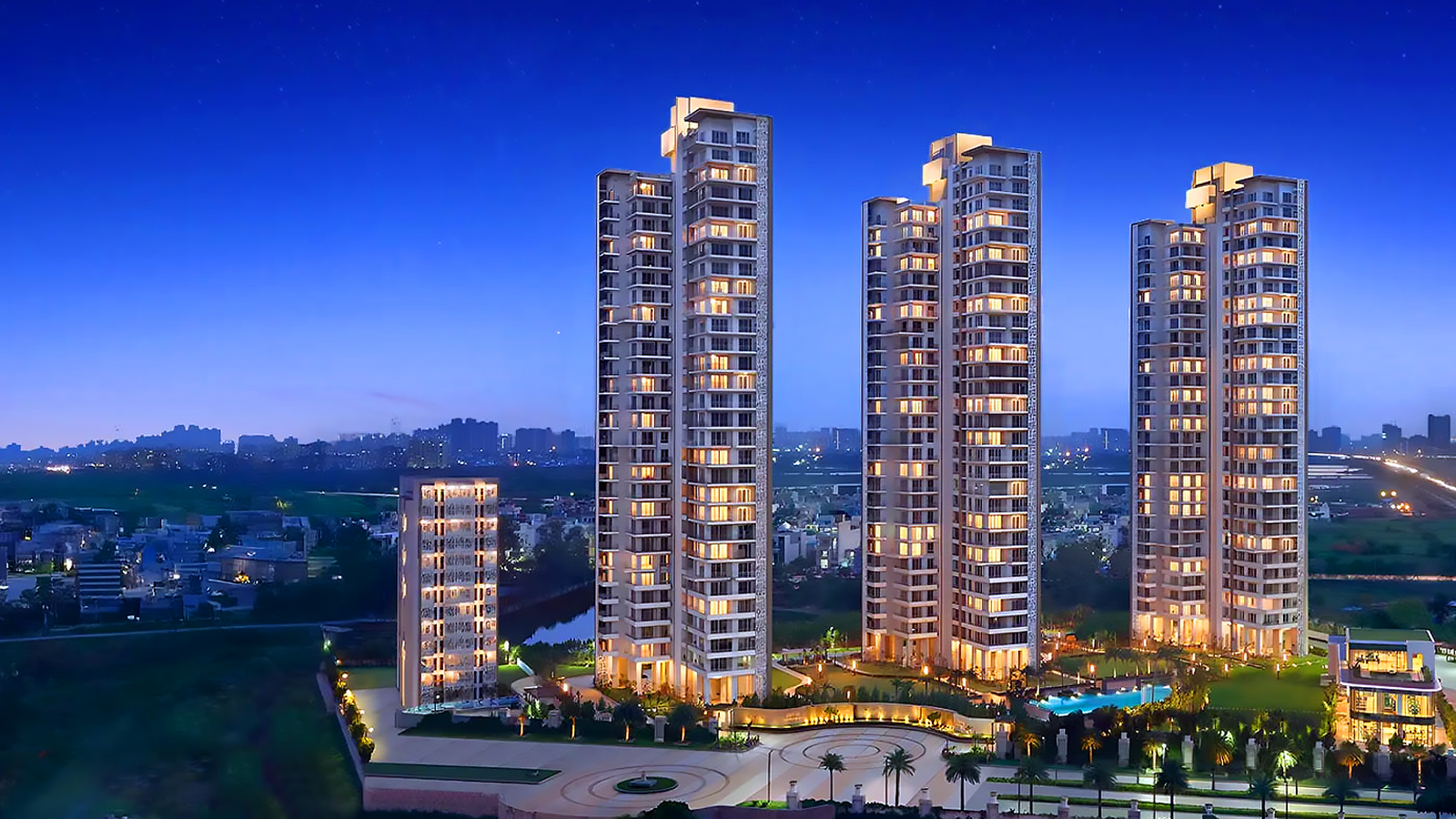 Tall modern buildings with blue sky and green trees in front
